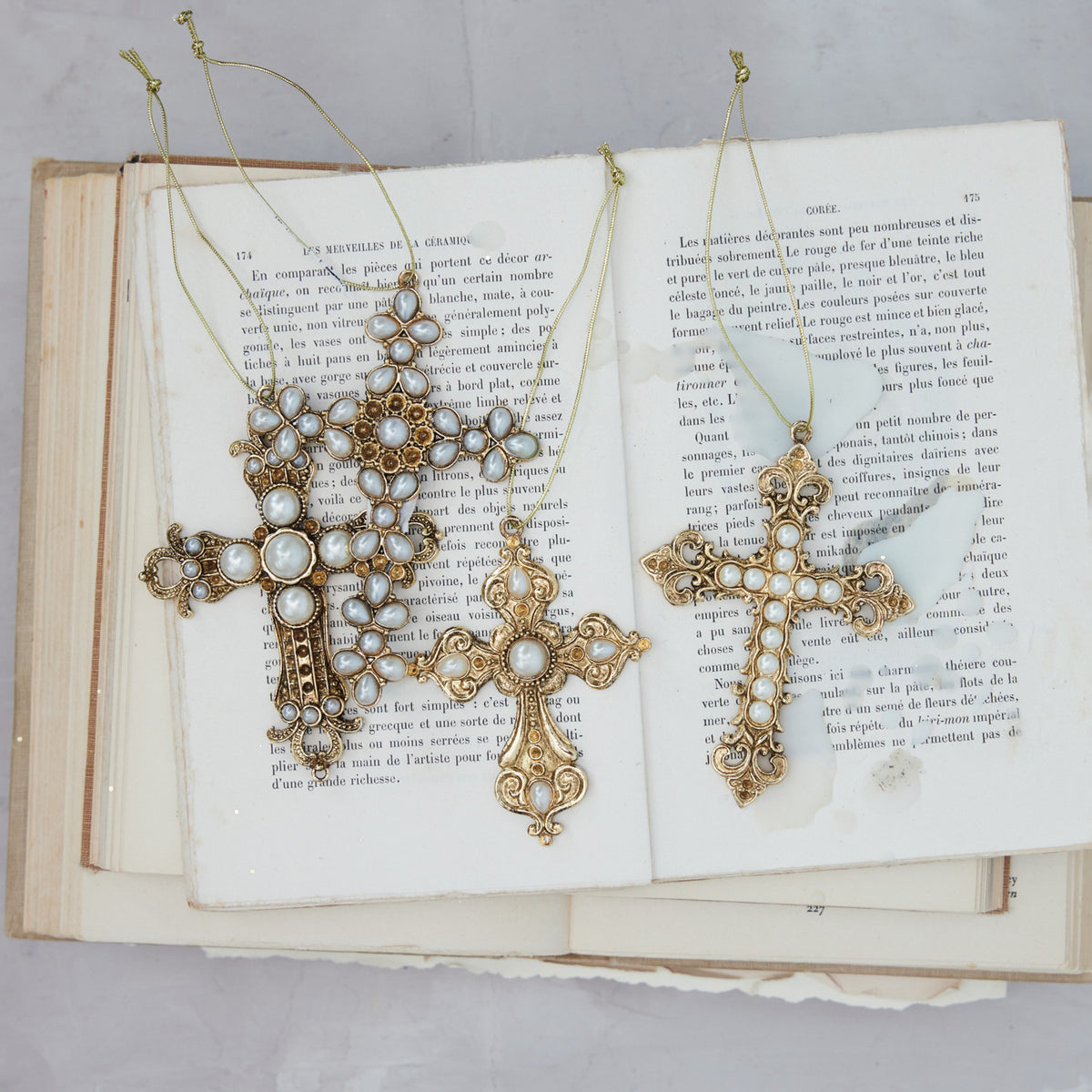 Gold pewter cross ornament with faux pearls
