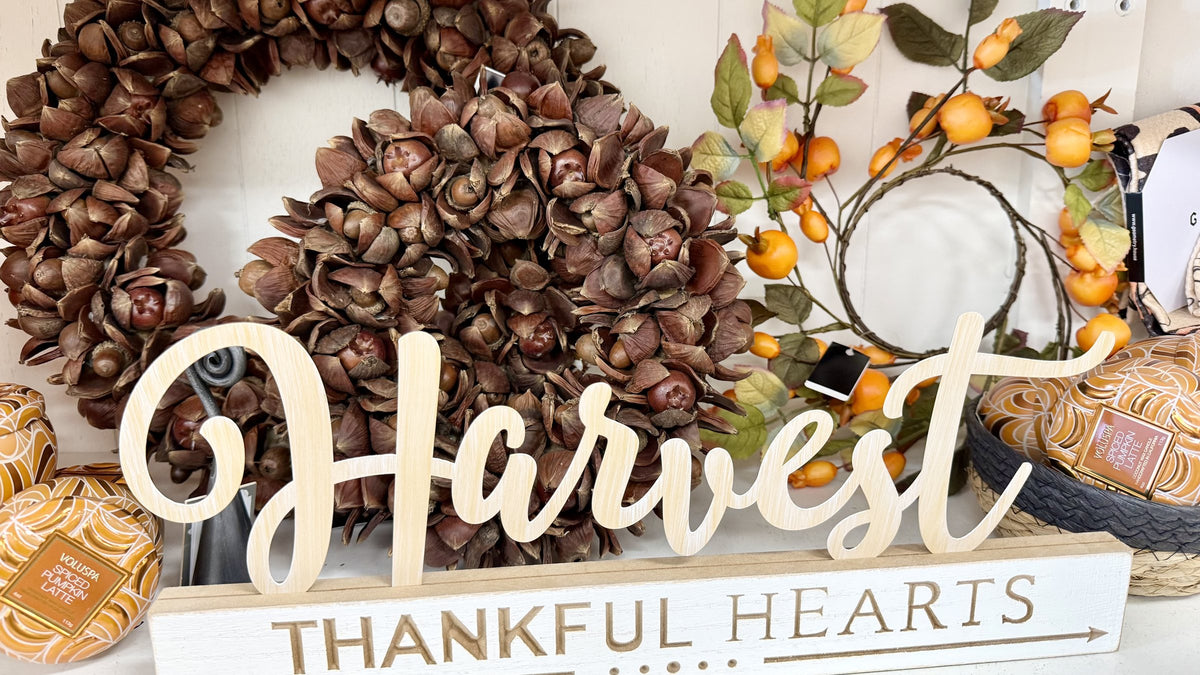 Fall harvest wreath and pumpkin candle display